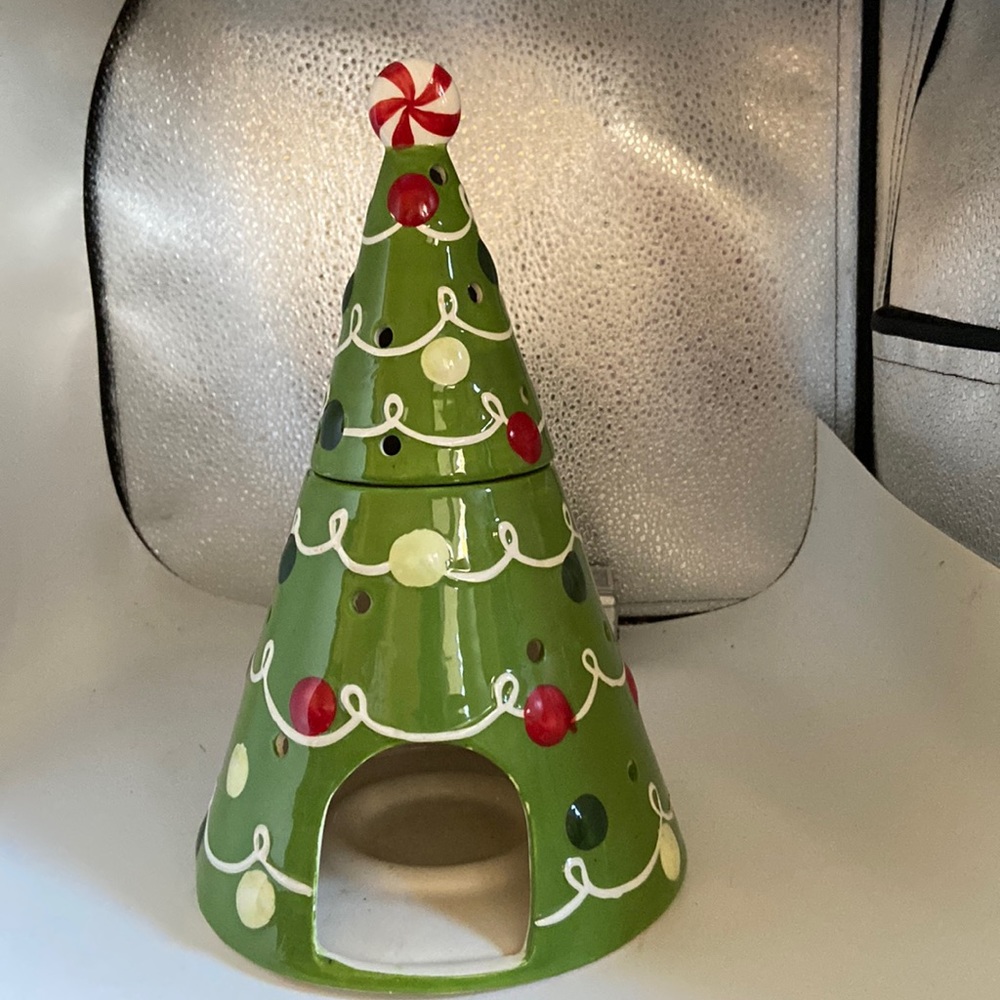 Christmas tree ceramic with space for candles light shows through holes